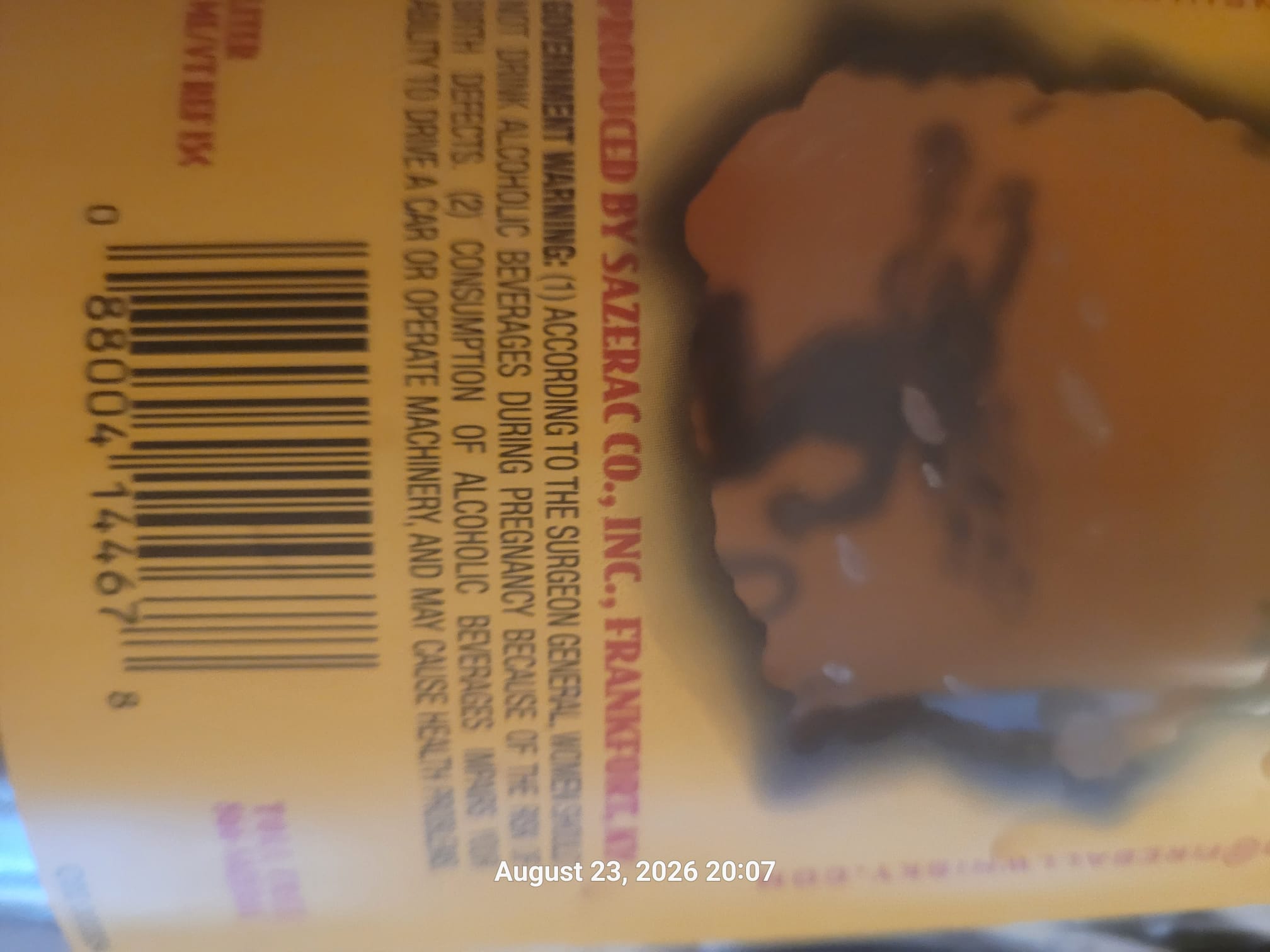 Rotated view of the back label showing the American bottler information on Ted Lee's Fireball cinnamon whisky bottle
